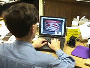 Archaeologist using PowerBook