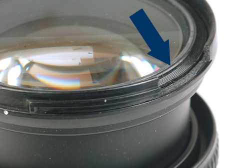 Closeup to the Nikkor AF lens broken part. 